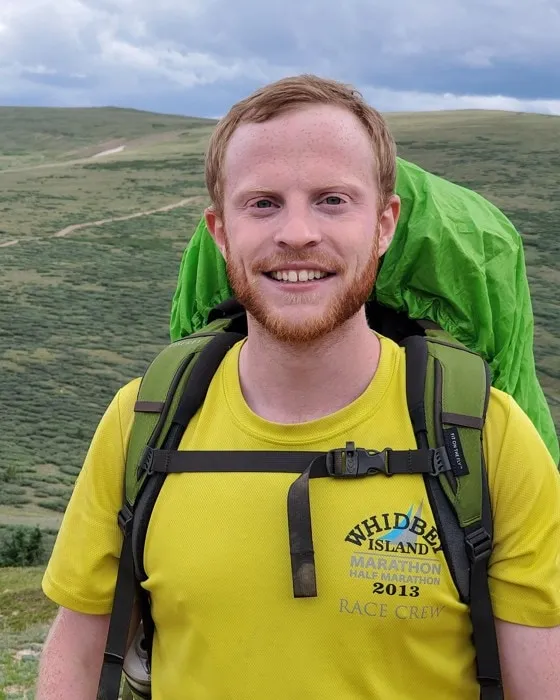 Portrait of Tamir, outdoors in the Colorado mountains.